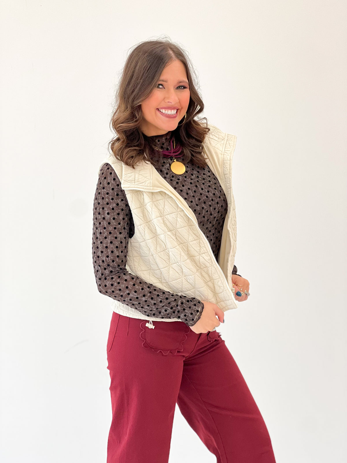 Ivory textured quilted collared vest with diamond stitching and sleeveless front panel