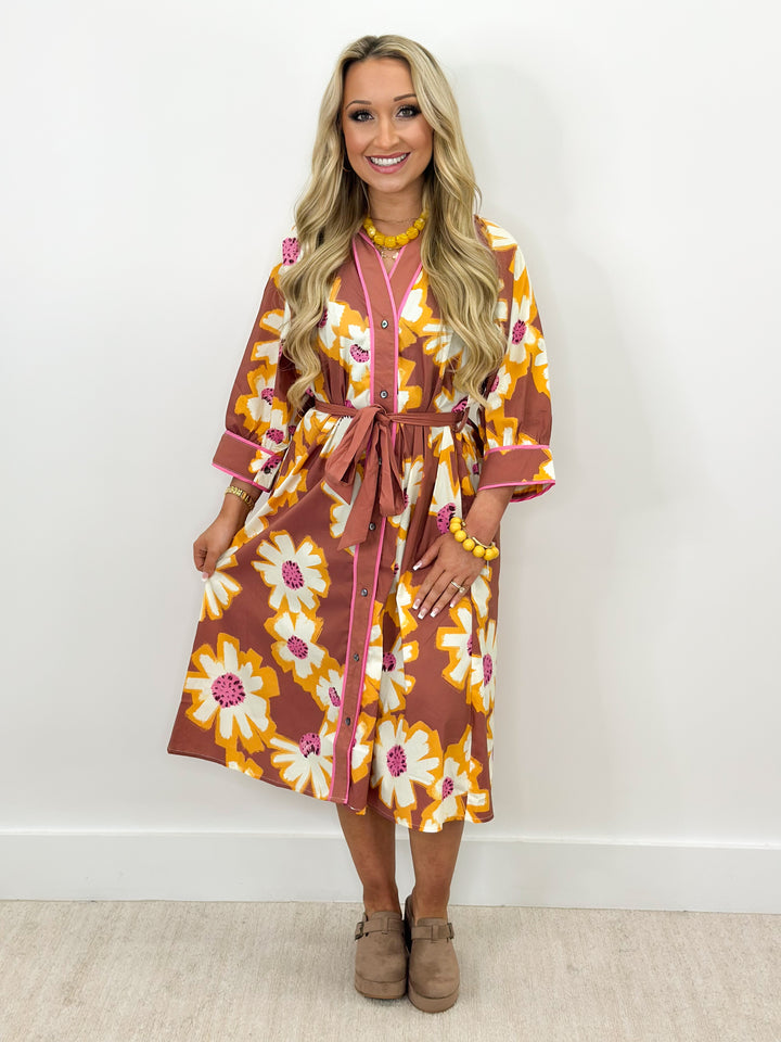 Floral midi shirt dress with V-neck button front, tie belt at waist, camel