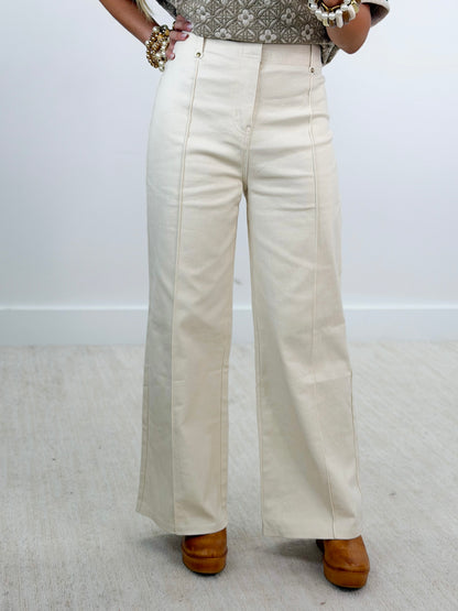 Off-white front-seam wide-leg trousers with straight, wide legs
