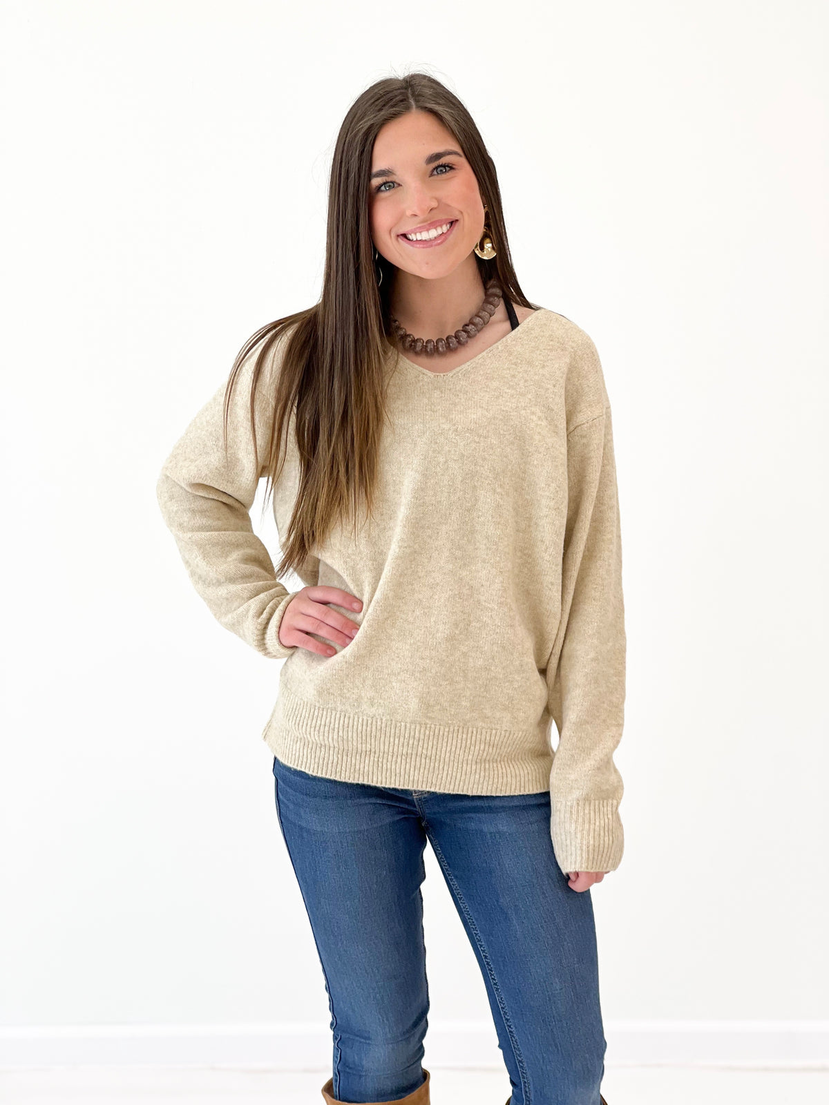 Oatmeal v-neck long-sleeve knit sweater with ribbed hem and cuffs, front view