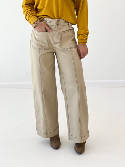 Entro bone pants, light tan with front patch pockets and relaxed straight-leg fit