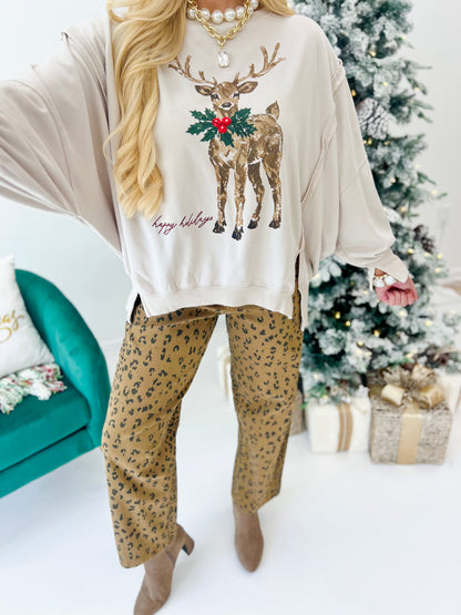Bone reindeer sweatshirt close-up with colorful wreath graphic