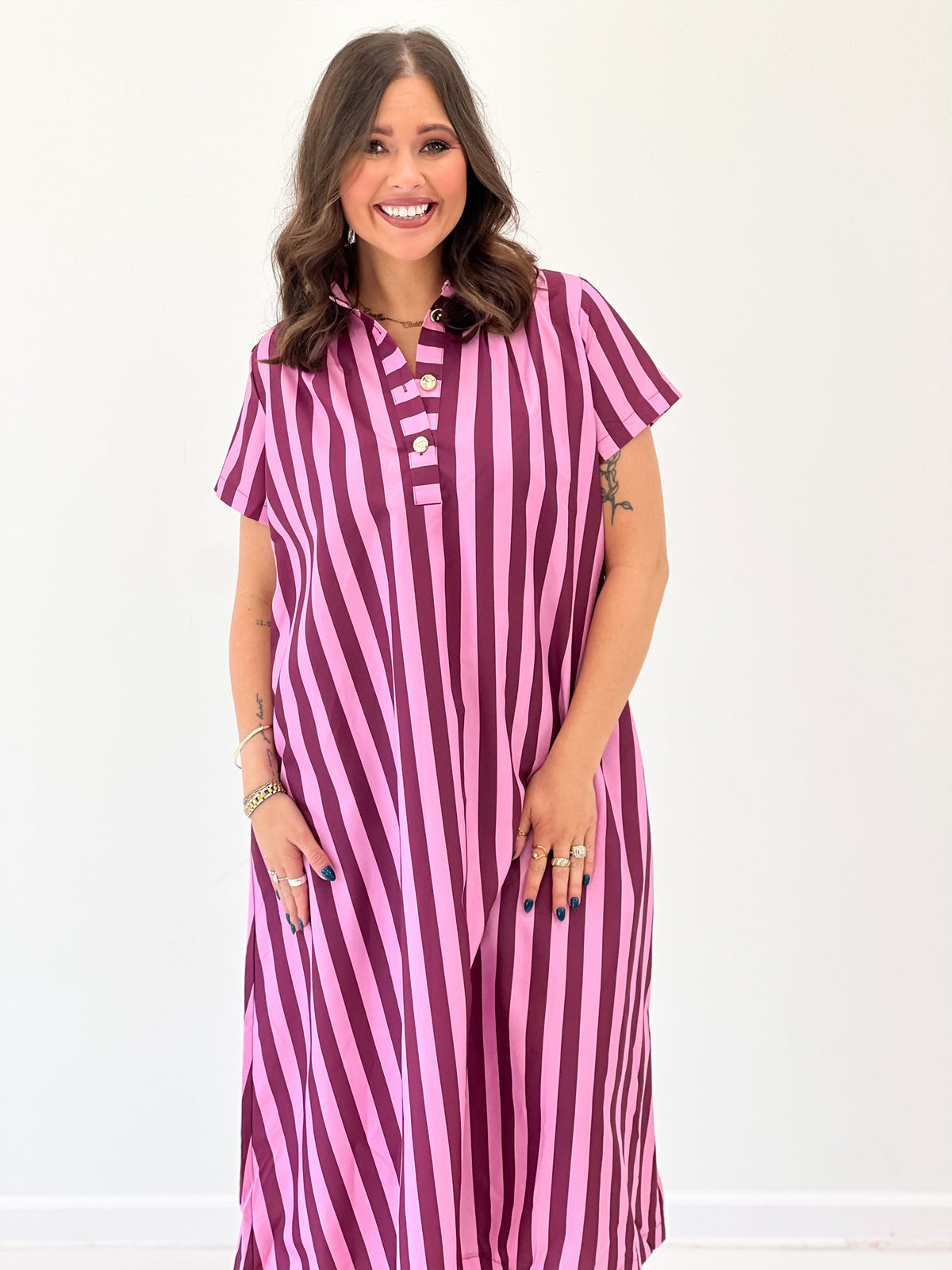Pink striped midi dress with high neck, button placket, and short sleeves