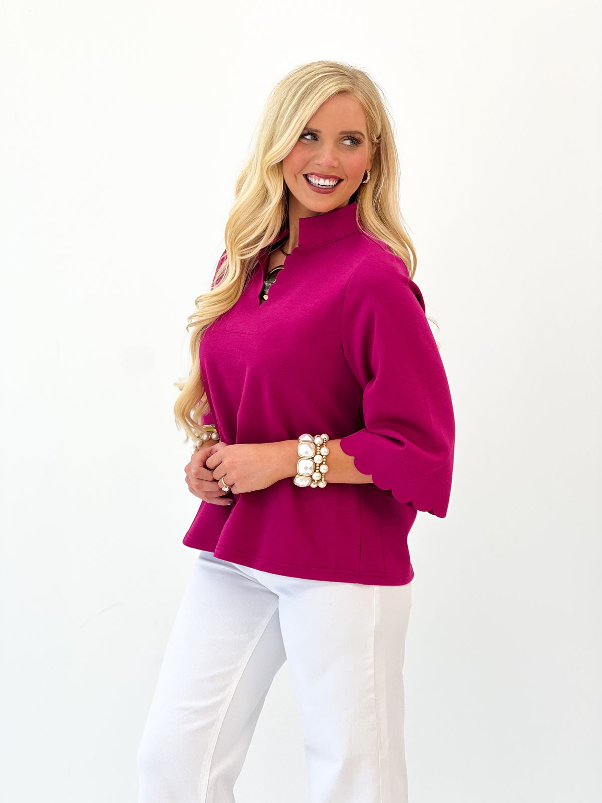 Scallop-trim V-neck 3/4 sleeve top with flared cuffs, magenta, close-up