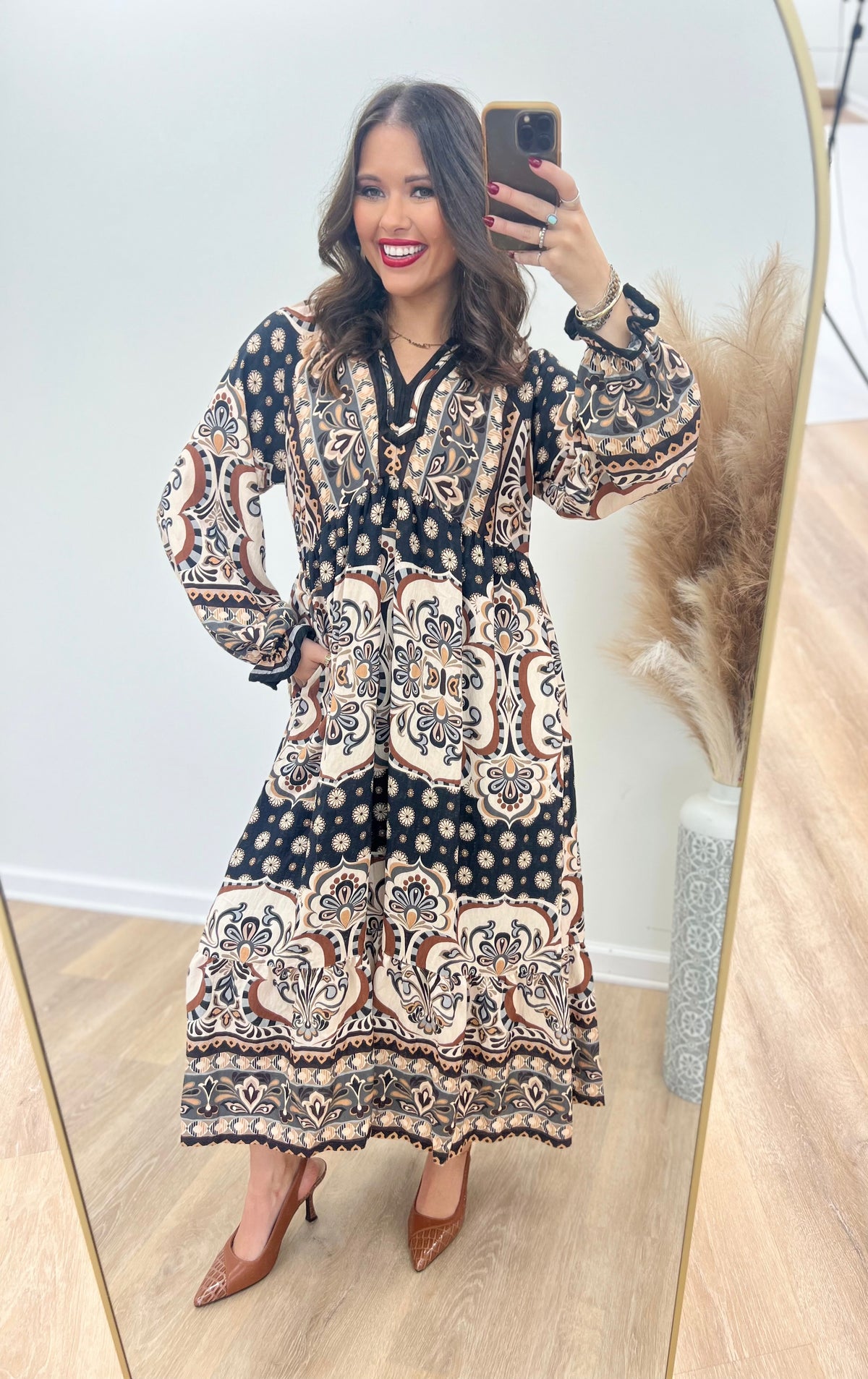 Abstract print midi dress with contrast trim, V-neck, and long sleeves