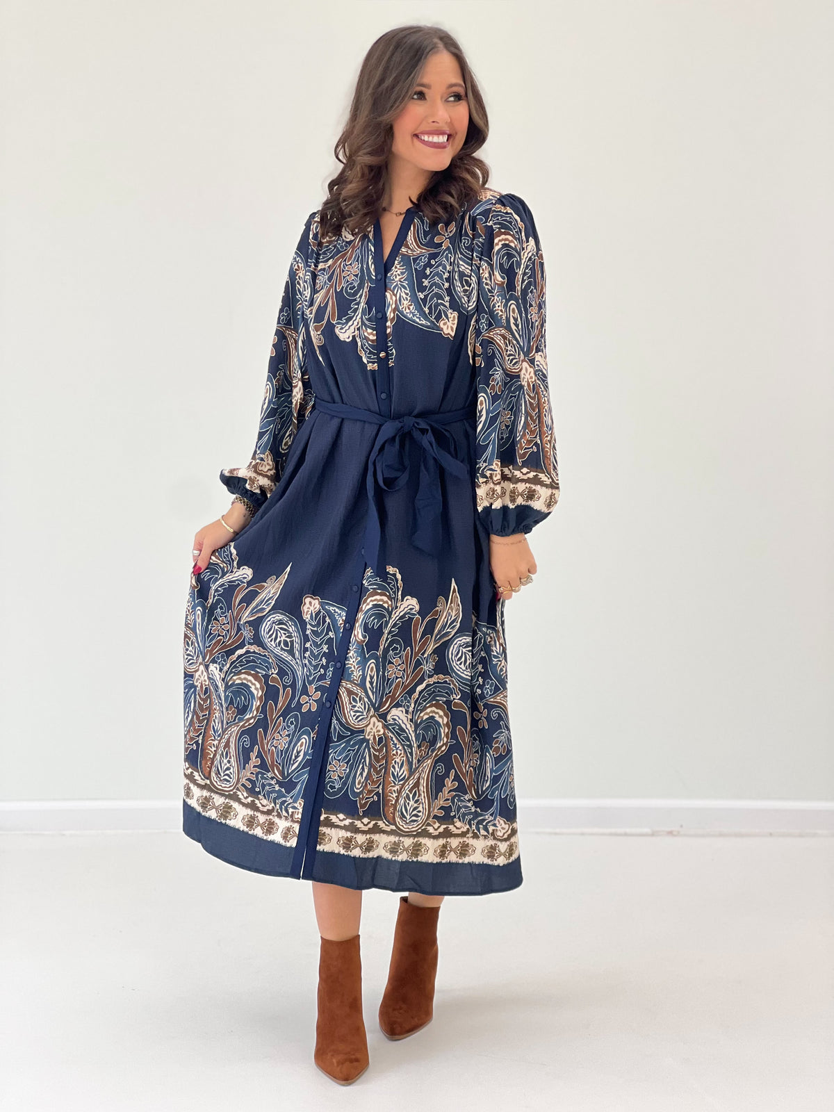 Navy abstract paisley long-sleeve dress, button front, tied waist, ruffled sleeve cuffs
