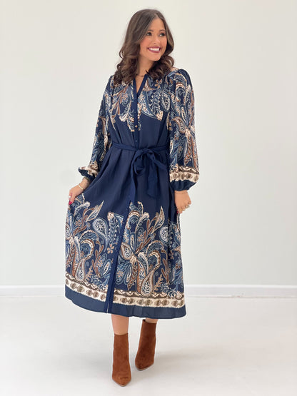Navy abstract paisley long-sleeve dress, button front, tied waist, ruffled sleeve cuffs
