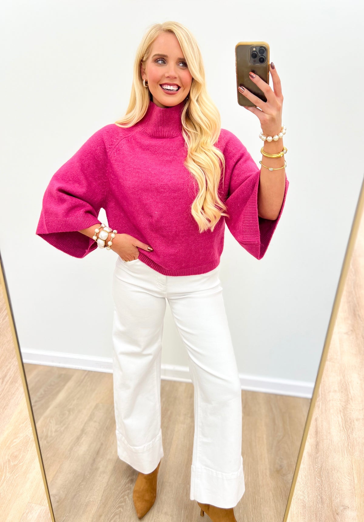 Fuchsia pink wide-sleeve mock neck sweater with ribbed collar and relaxed fit