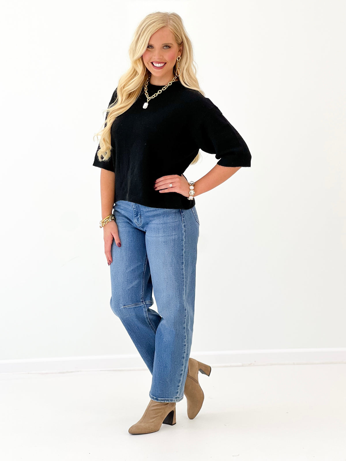 Heathered black crew neck sweater with short sleeves and clean neckline