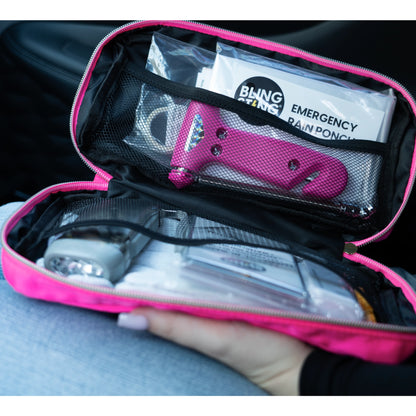 Pink zippered emergency supplies kit pouch with rain poncho, blanket, and tools
