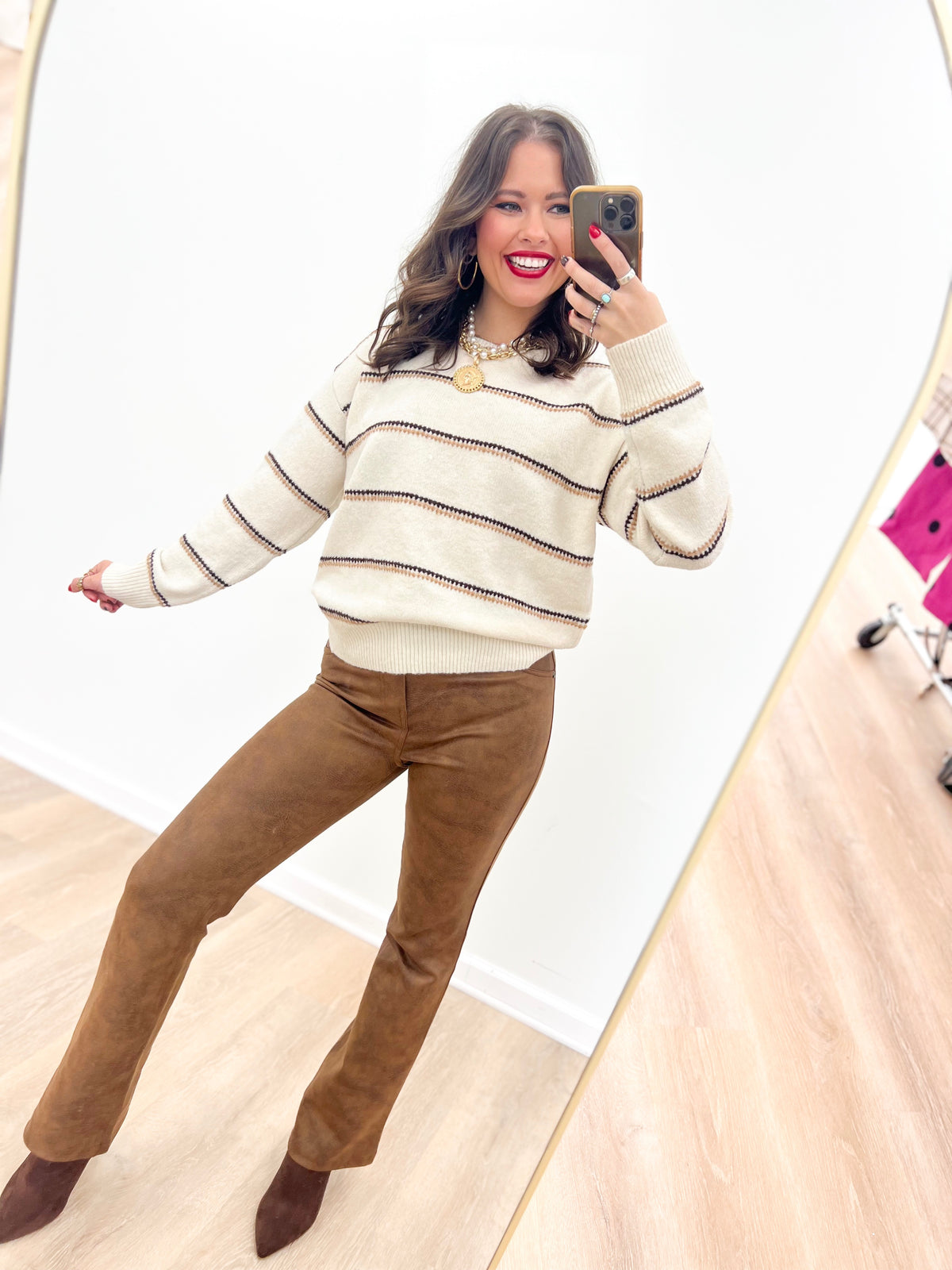 Oatmeal striped knit sweater with crew neckline, long sleeves, ribbed cuffs