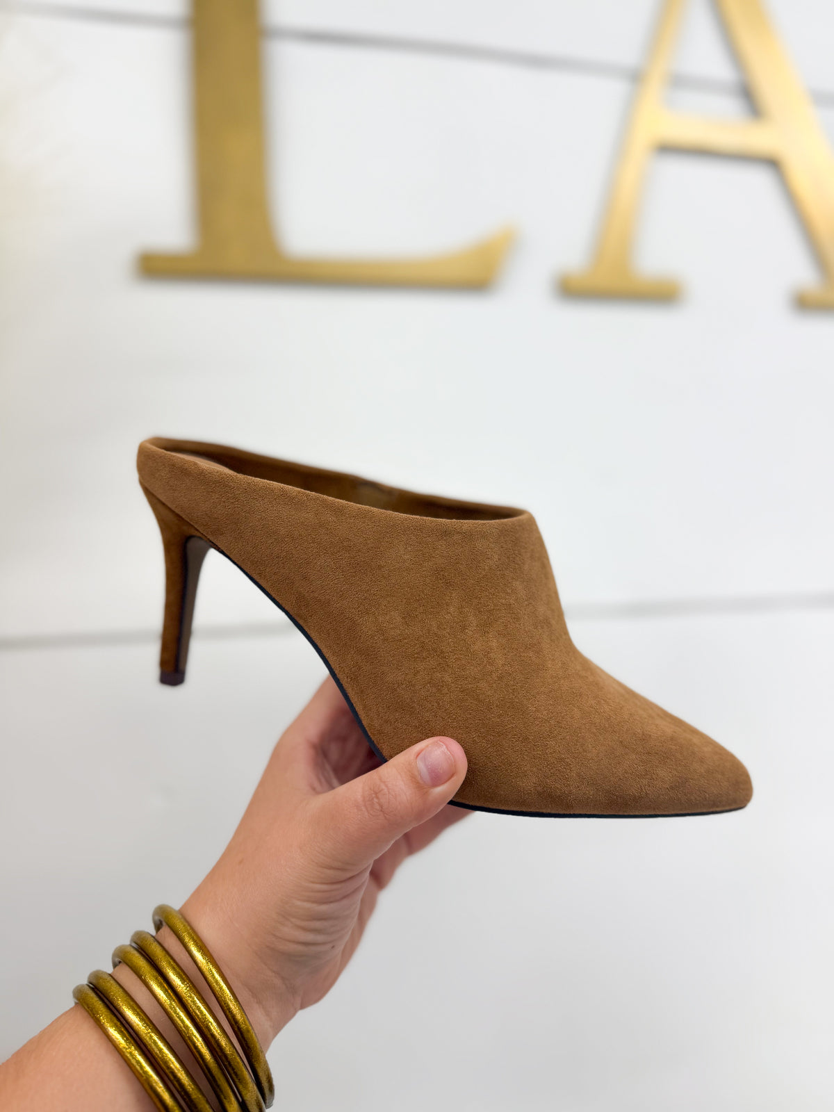 Camel suede mule with pointed toe and slender kitten heel, slip-on style