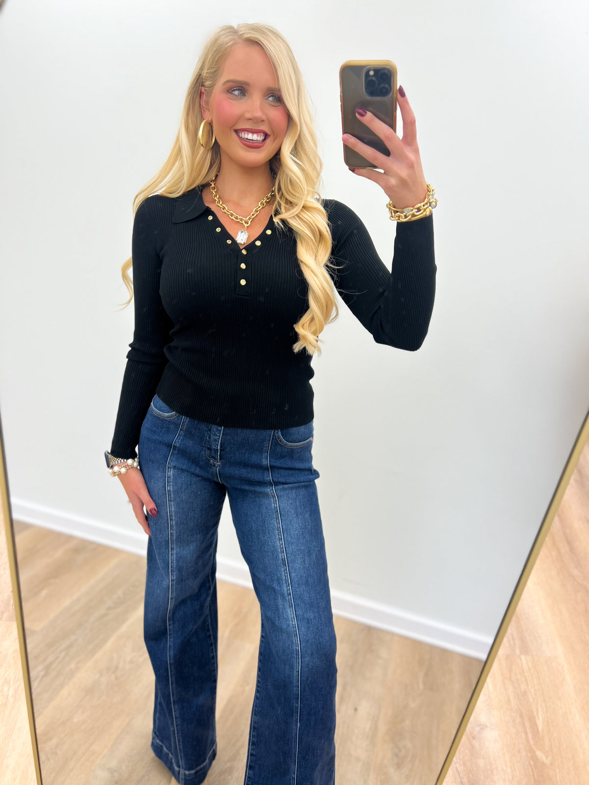 Black collared snap-button sweater with short front placket detail