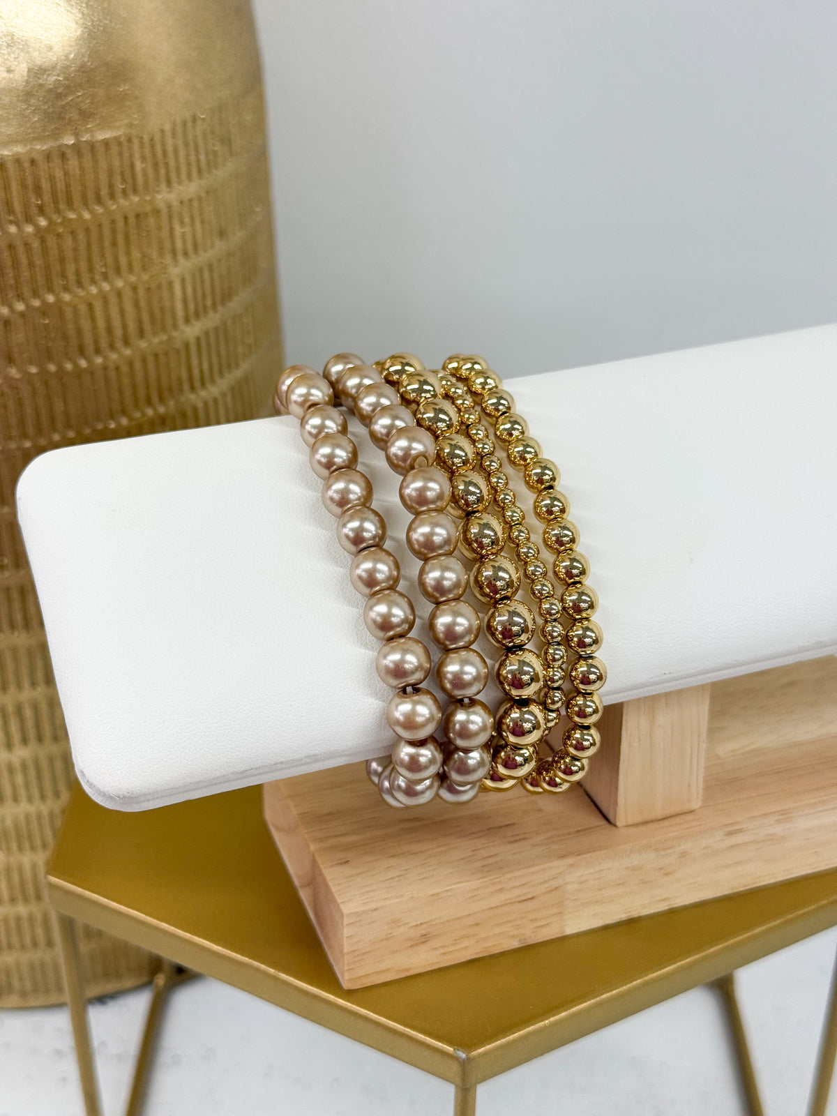 Gold and pearl 5-row bracelet with rounded bead rows in stacked coils