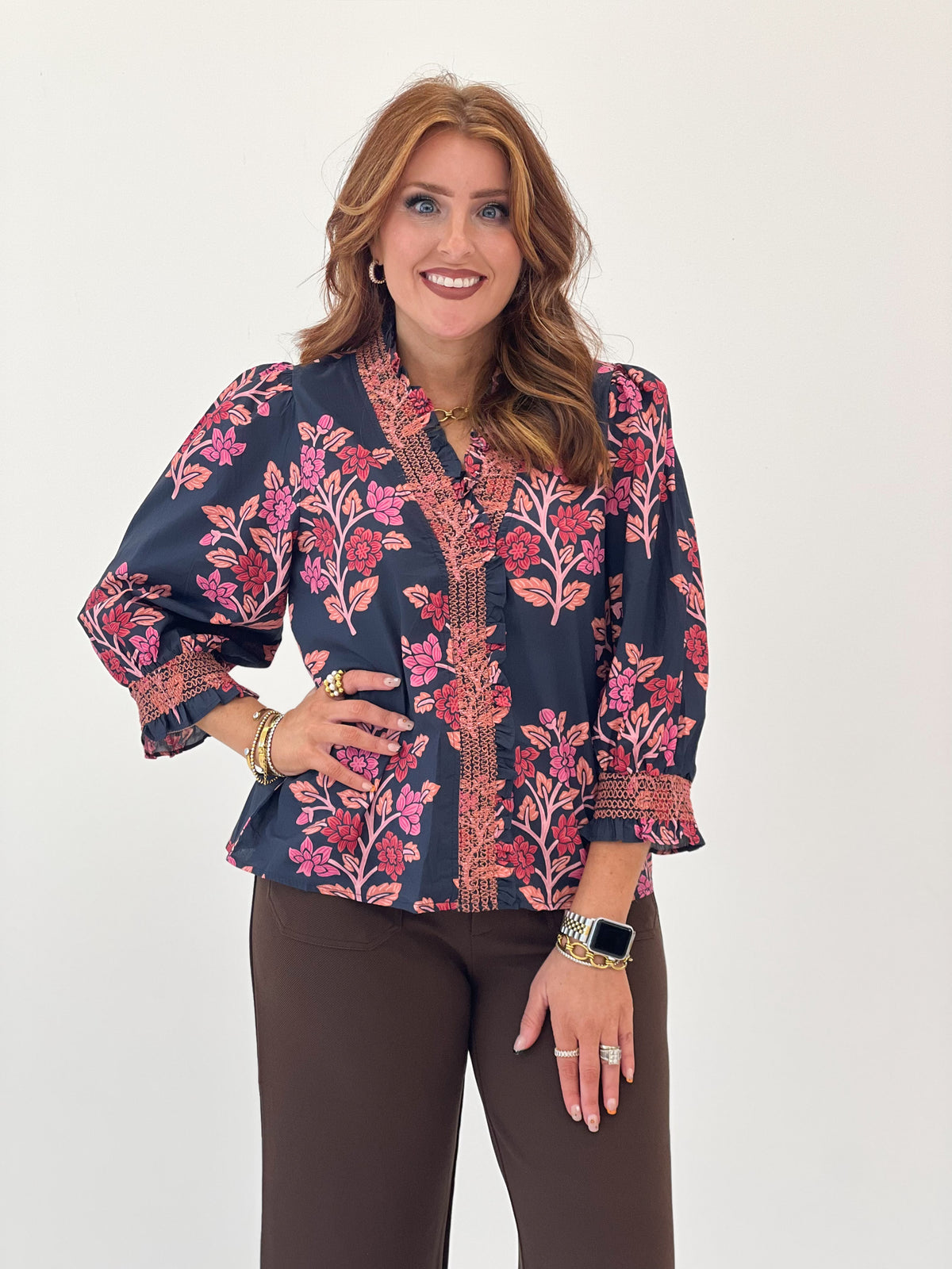 Navy floral smocked ruffle puff sleeve top with textured front placket
