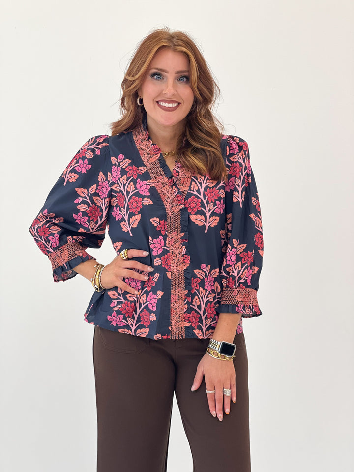 Navy floral smocked ruffle puff sleeve top with textured front placket