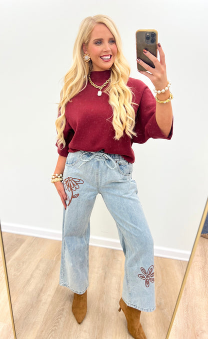 Burgundy mock-neck pullover sweater with draped short sleeves