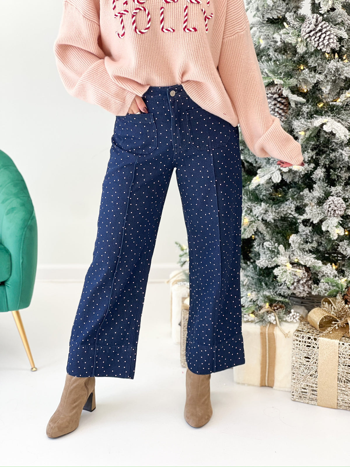 Dark denim polka dot wide-leg pants with patch pockets, angled front