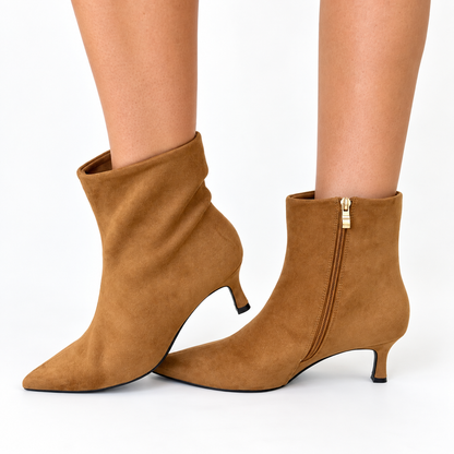 Camel suede ankle boots with side zipper and short block heel, angled side view
