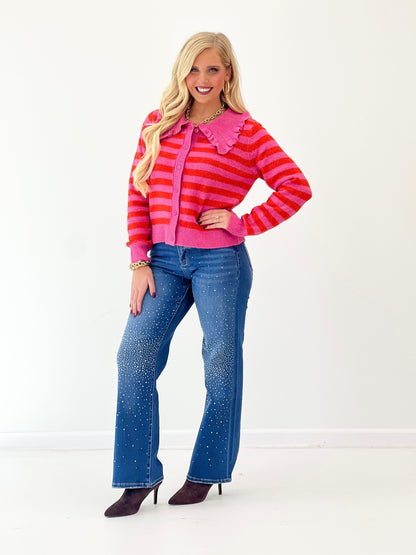Hot pink striped sweater cardigan with ruffled collar and button-front, long sleeve knit