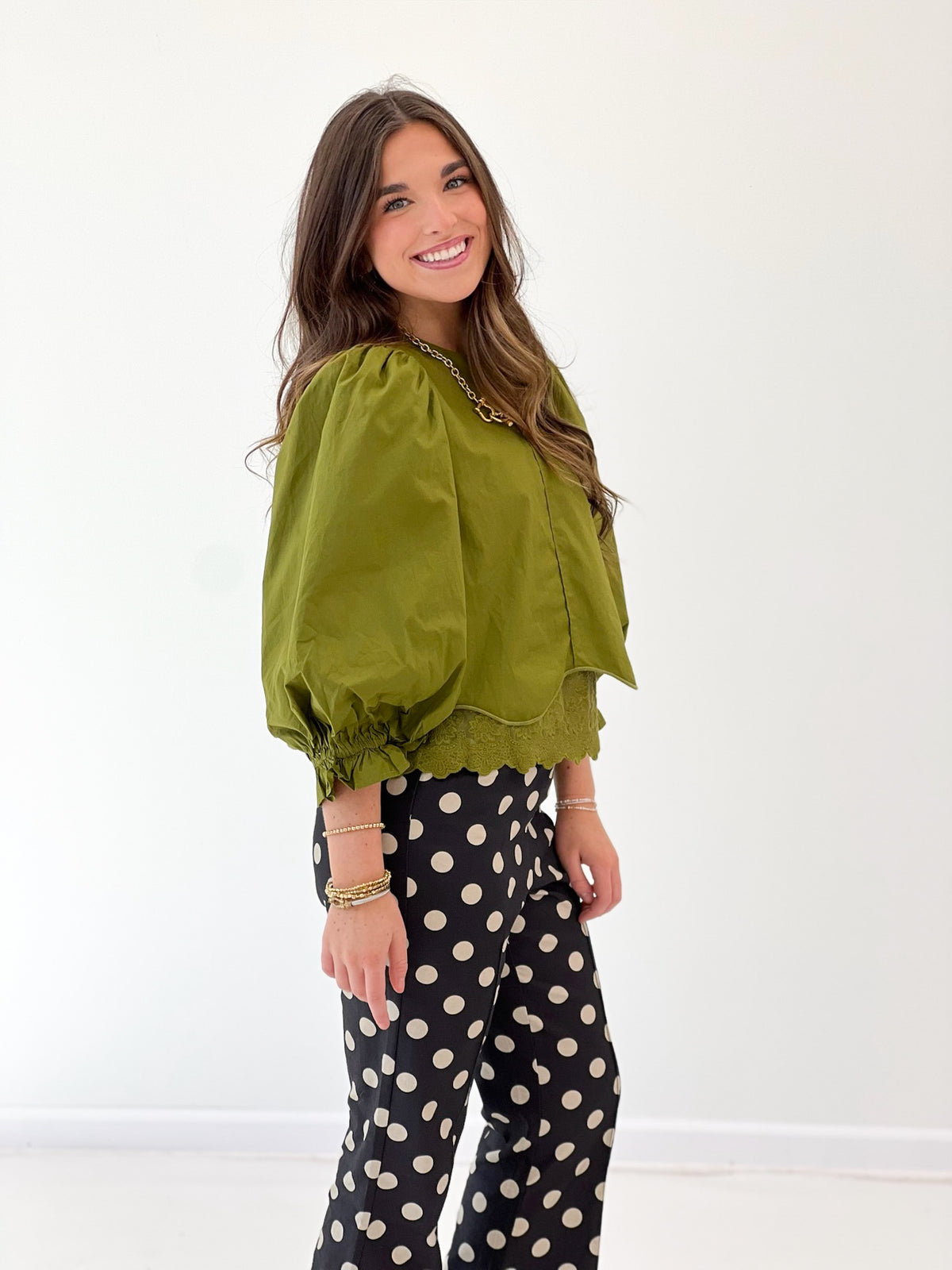 Olive green balloon sleeve blouse with lace-trim scalloped hem and scoop neck