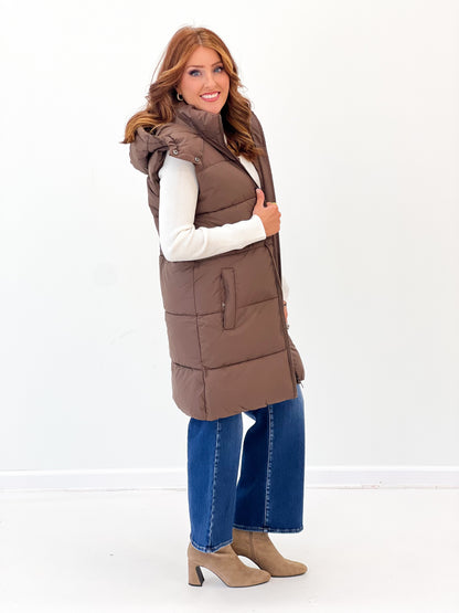 Longline quilted puffer vest in brown with hooded collar and side pockets