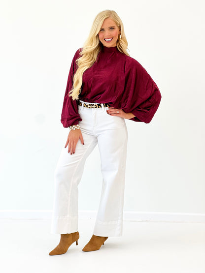 Burgundy polka dot high-neck blouse with loose balloon sleeves