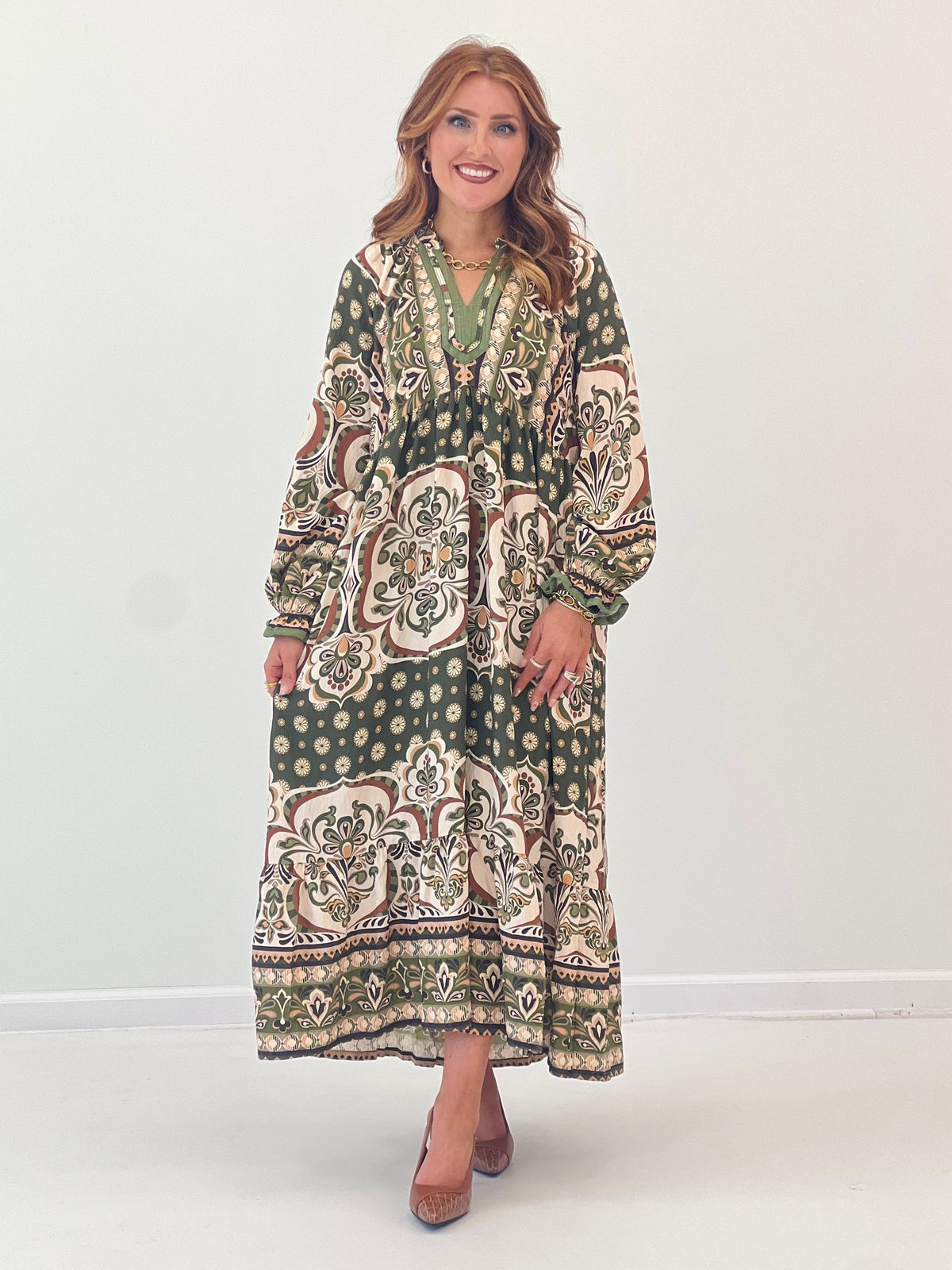 Abstract print midi dress with contrast trim, V-neck, long sleeves, and pockets