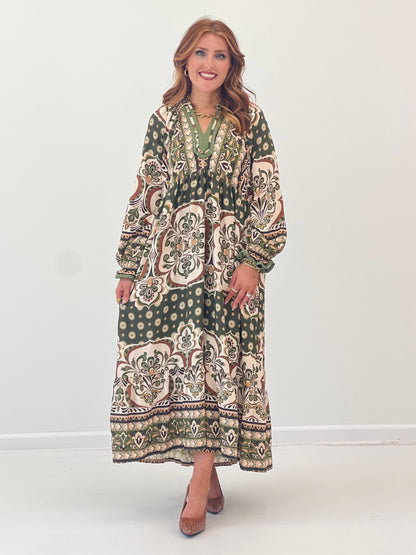 Abstract print midi dress with contrast trim, V-neck, long sleeves, and pockets
