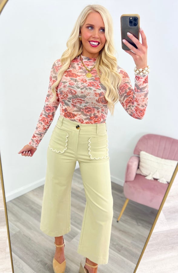 Light cream cropped wide-leg pants with scalloped front pockets