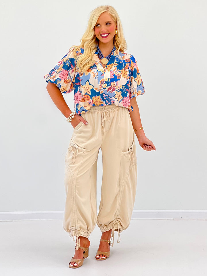 Dusty blue floral V-neck puff-sleeve blouse with smocked waistband