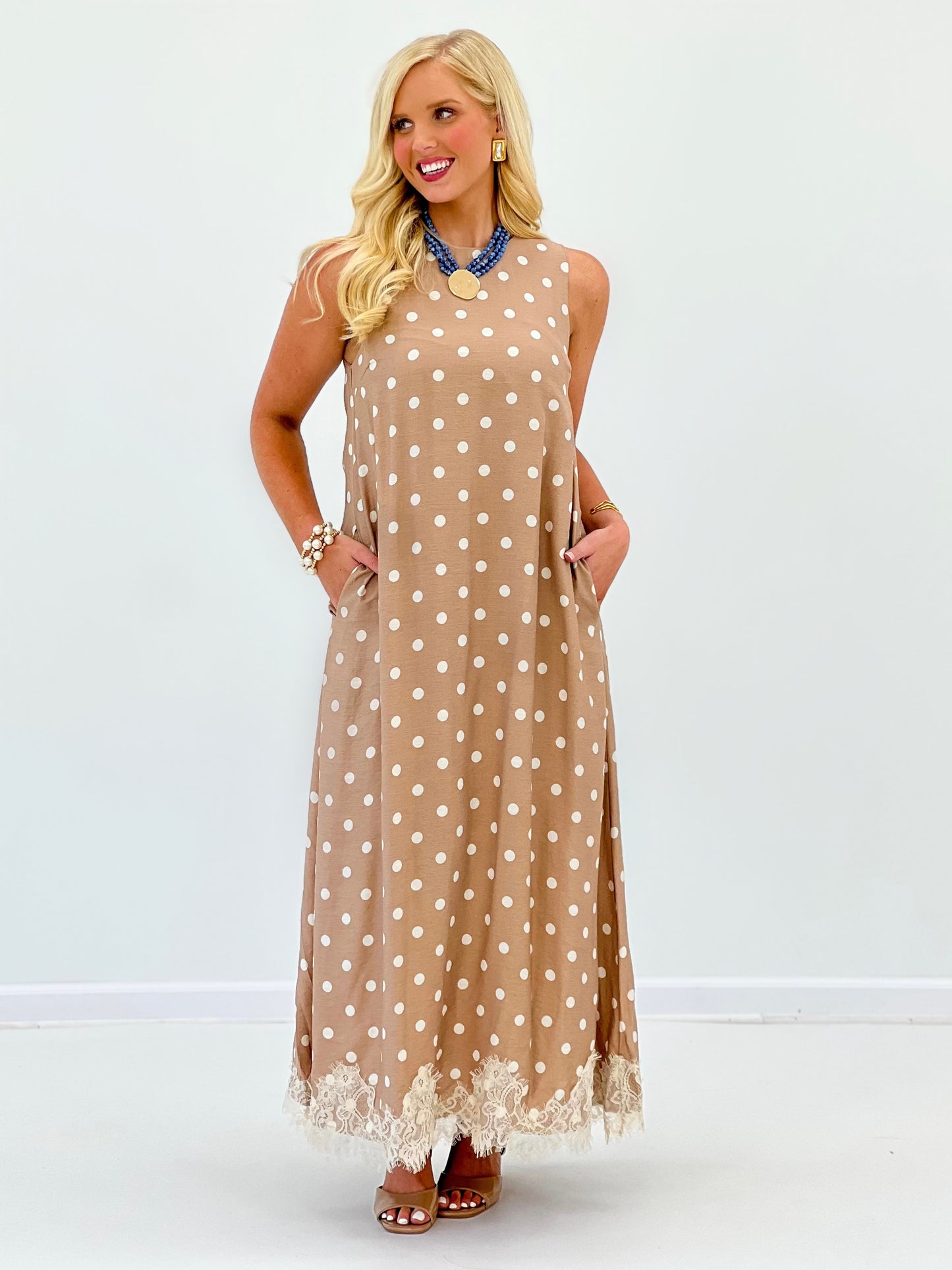 Latte polka dot sleeveless midi dress with A-line fit and lace-trim hem