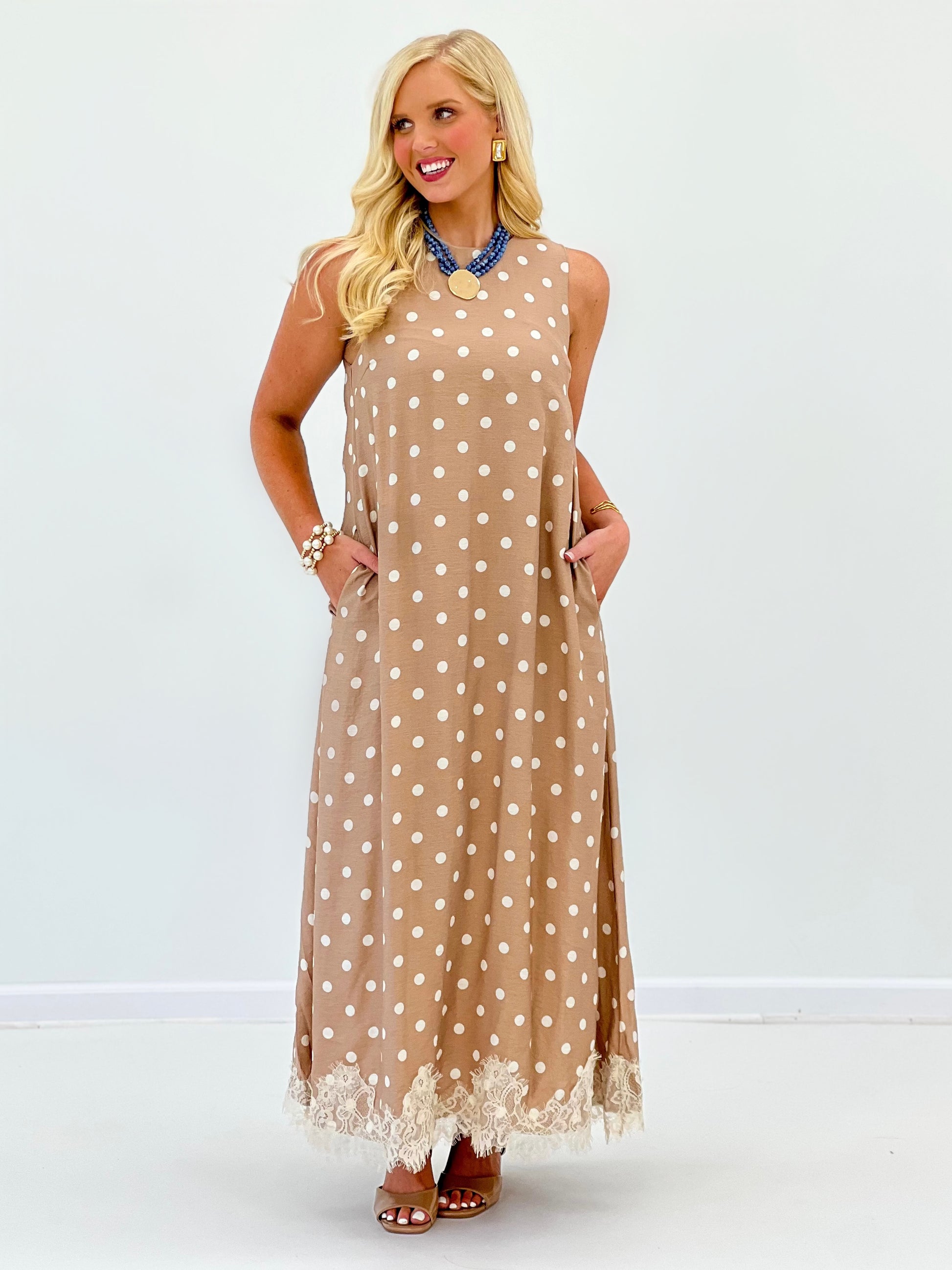 Latte polka dot sleeveless midi dress with A-line fit and lace-trim hem