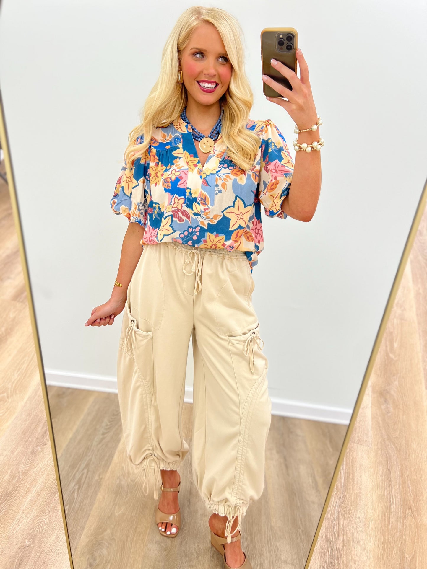 Dusty blue floral V-neck puff-sleeve top with gathered waist