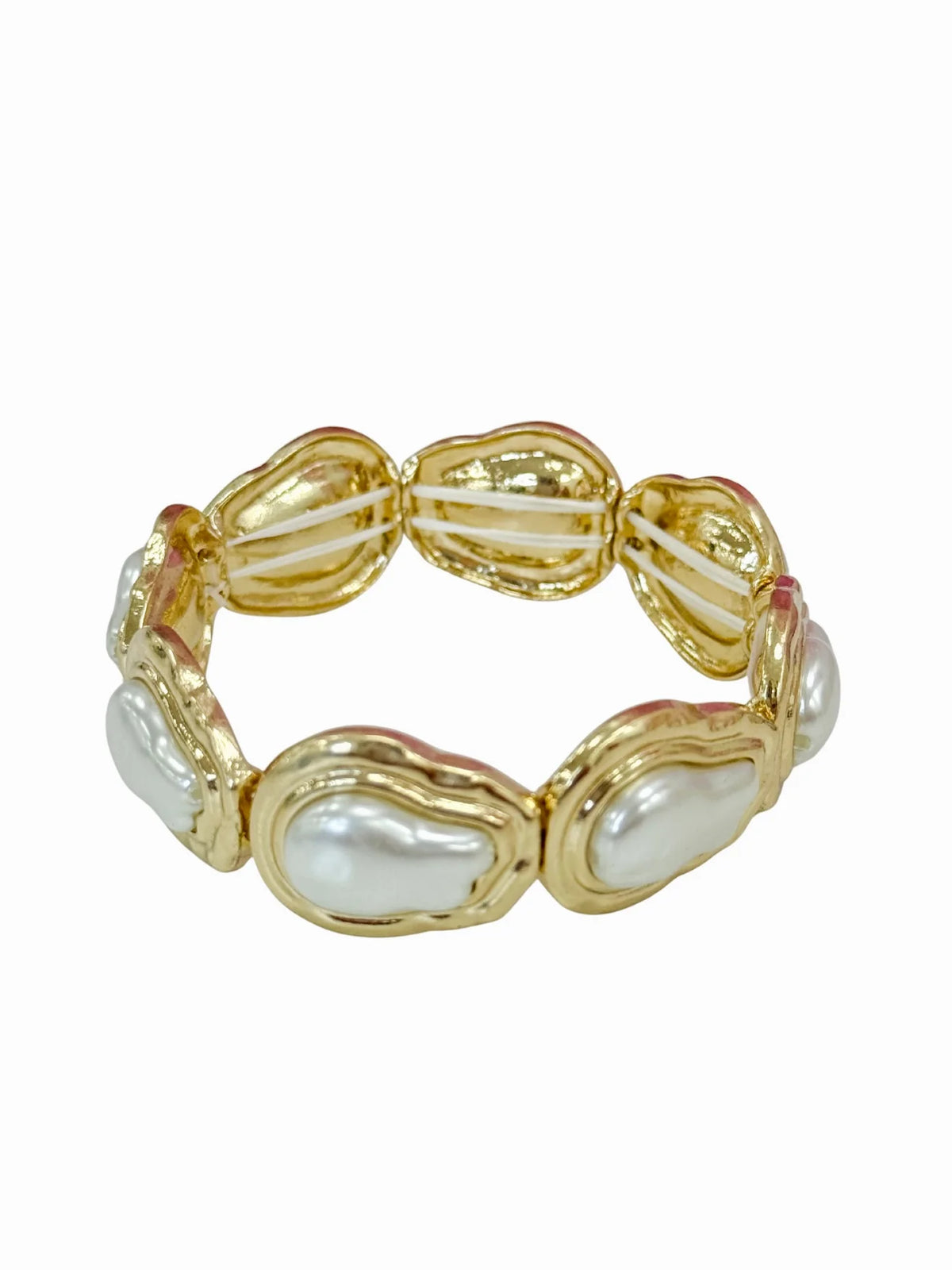 Gold baroque pearl bracelet with oval cream pearls in ornate gold links