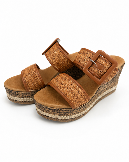 Woven raffia wedge sandals with tan buckled straps and platform espadrille sole
