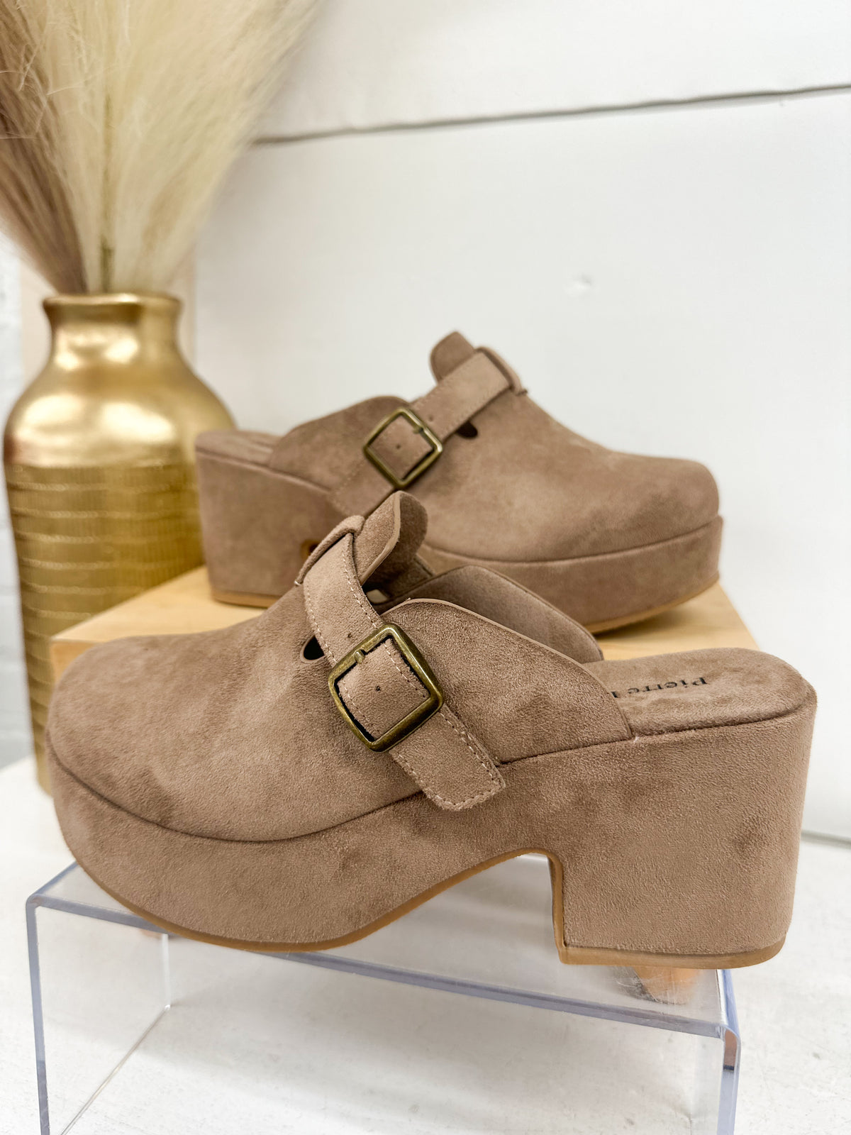 Taupe suede mule clog with two buckles across instep and mid block heel