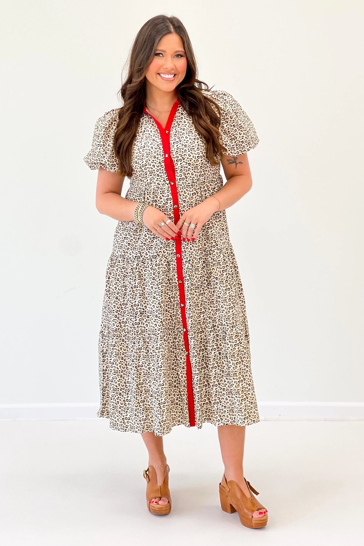 Animal-print puff sleeve dress with red button placket and Peter Pan collar