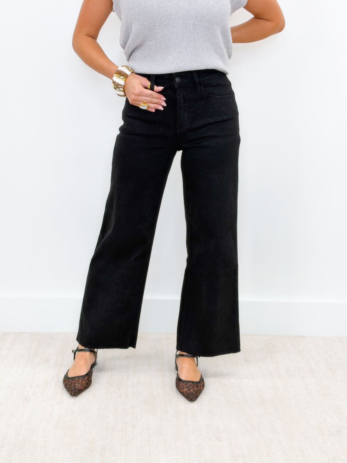 Black high-rise crop wide-leg jeans with belt loops and wide hems
