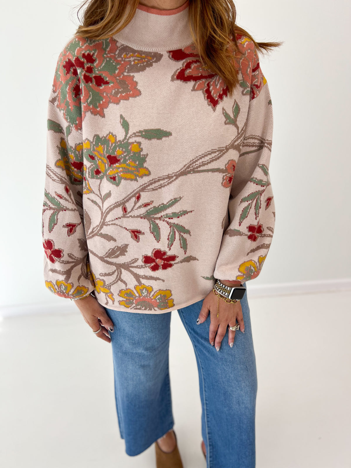 Beige floral jacquard knit mock neck sweater with long sleeves and relaxed fit