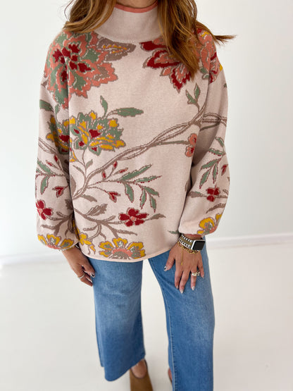 Beige floral jacquard knit mock neck sweater with long sleeves and relaxed fit