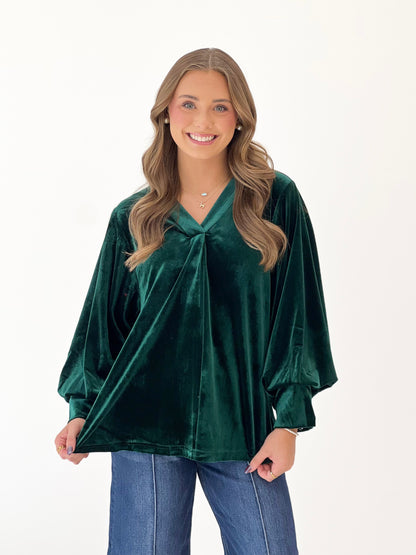 Hunter green velvet V-neck pleated top with puff sleeves and knot detail