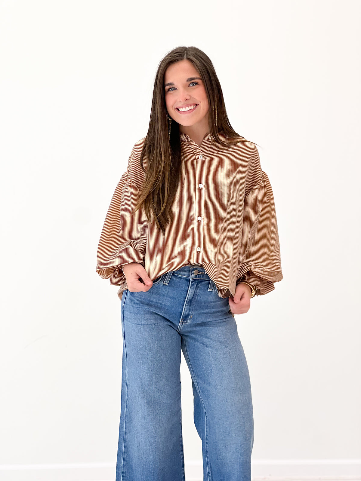 Camel brown pinstripe button-up blouse with bubble sleeves and front buttons