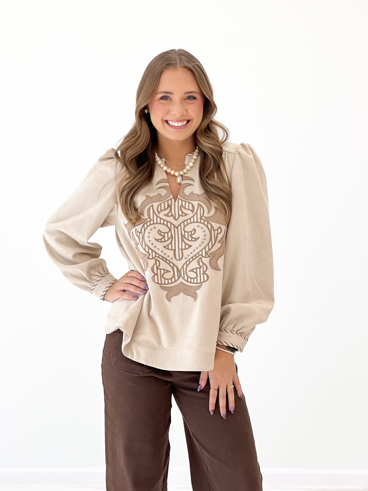 Stone faux suede look long-sleeve top with hamsa-style embroidered front