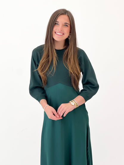 Dark green long-sleeve sweater dress with crew neck and fit-and-flare silhouette