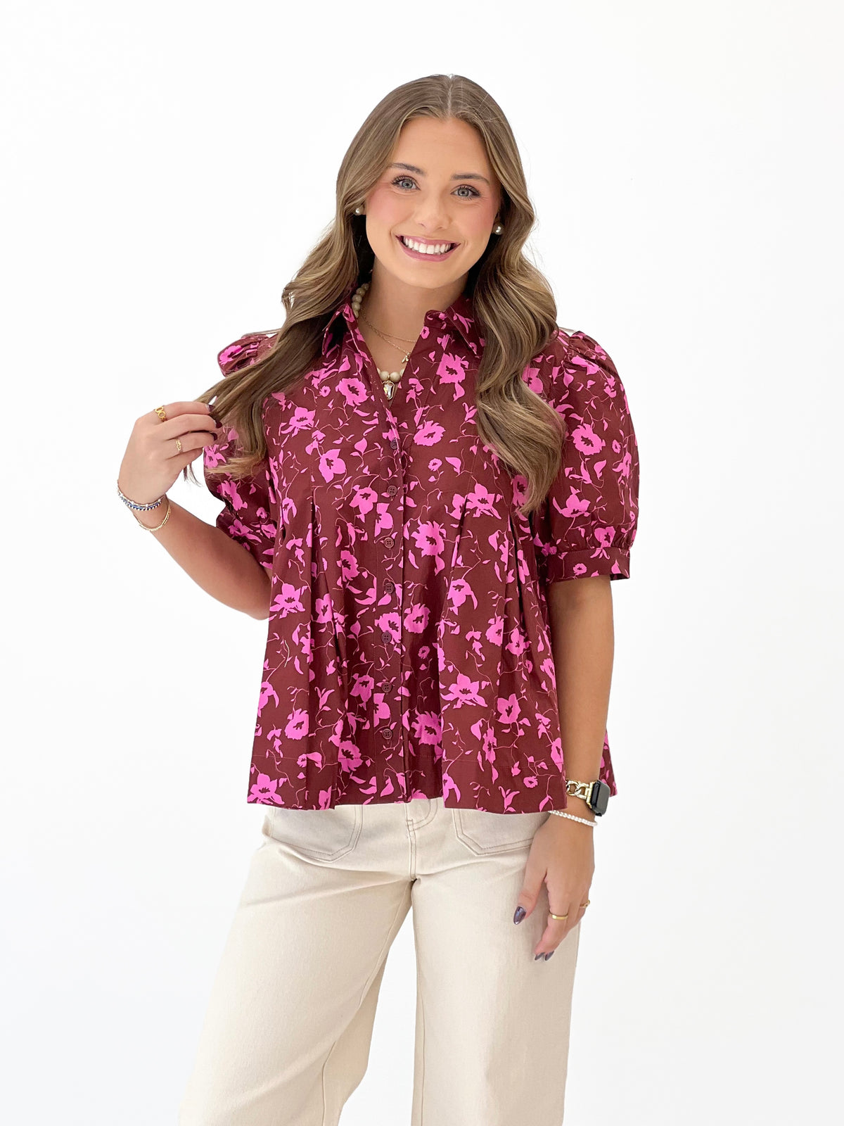 Burgundy floral short-sleeve blouse with button front and stand collar.