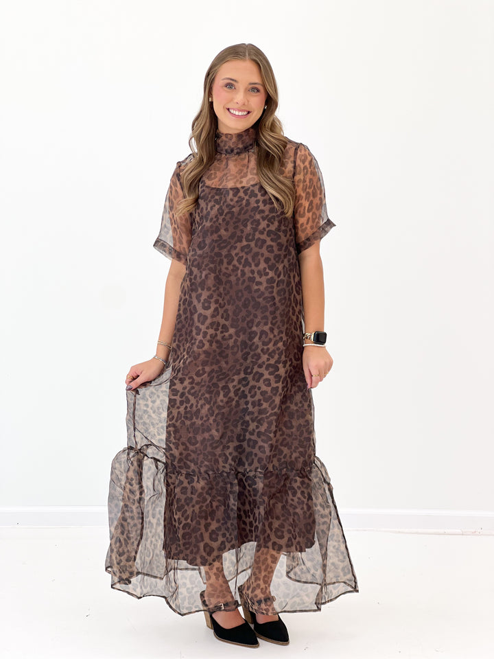 Leopard print midi dress with mock neck, short sleeves, and sheer ruffle hem