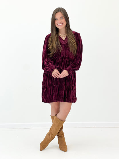 Burgundy velvet tiered mini dress with long sleeves and V-neck
