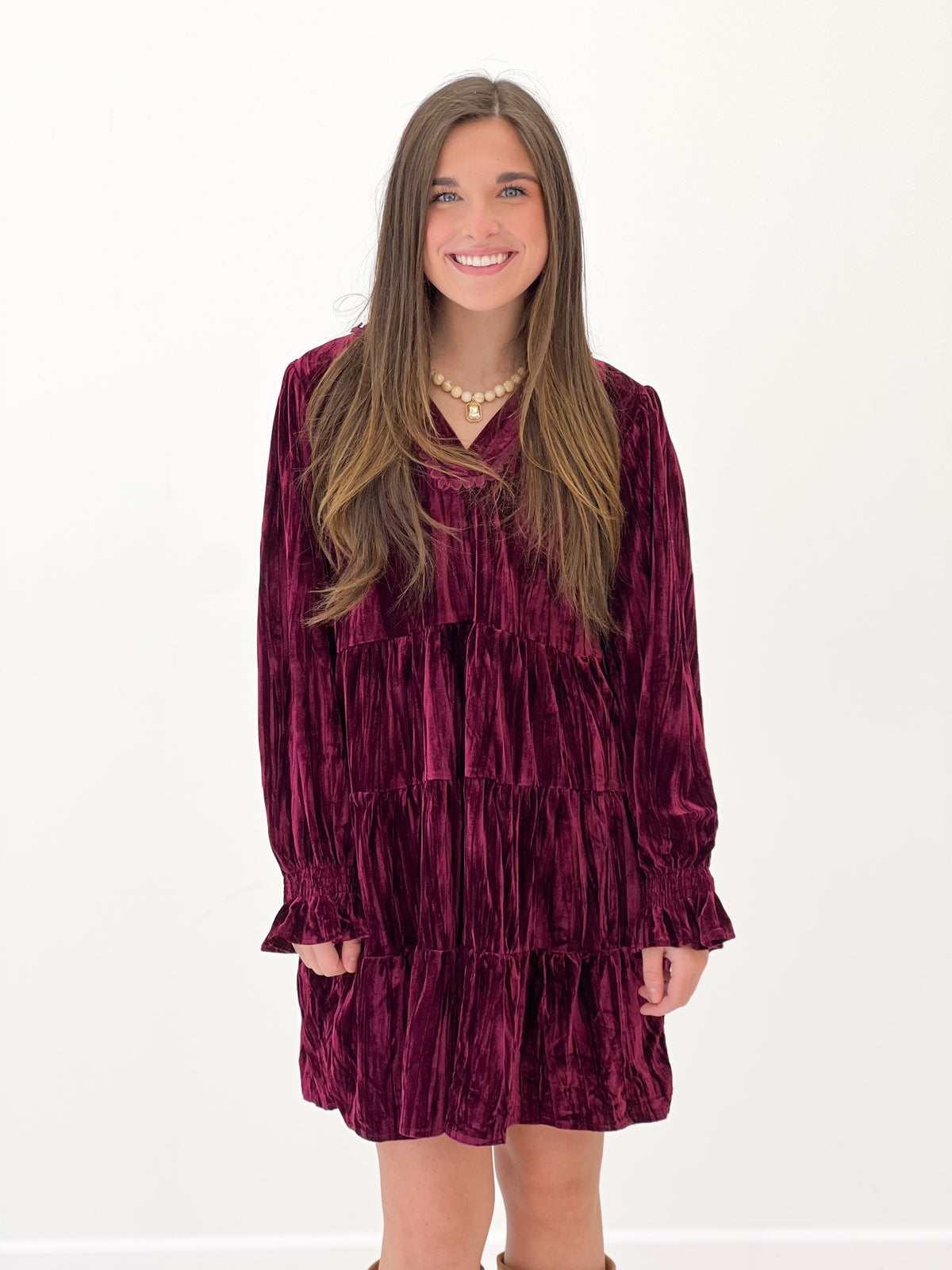 Burgundy velvet tiered long-sleeve mini dress, V-neck, gathered ruffle tiers
