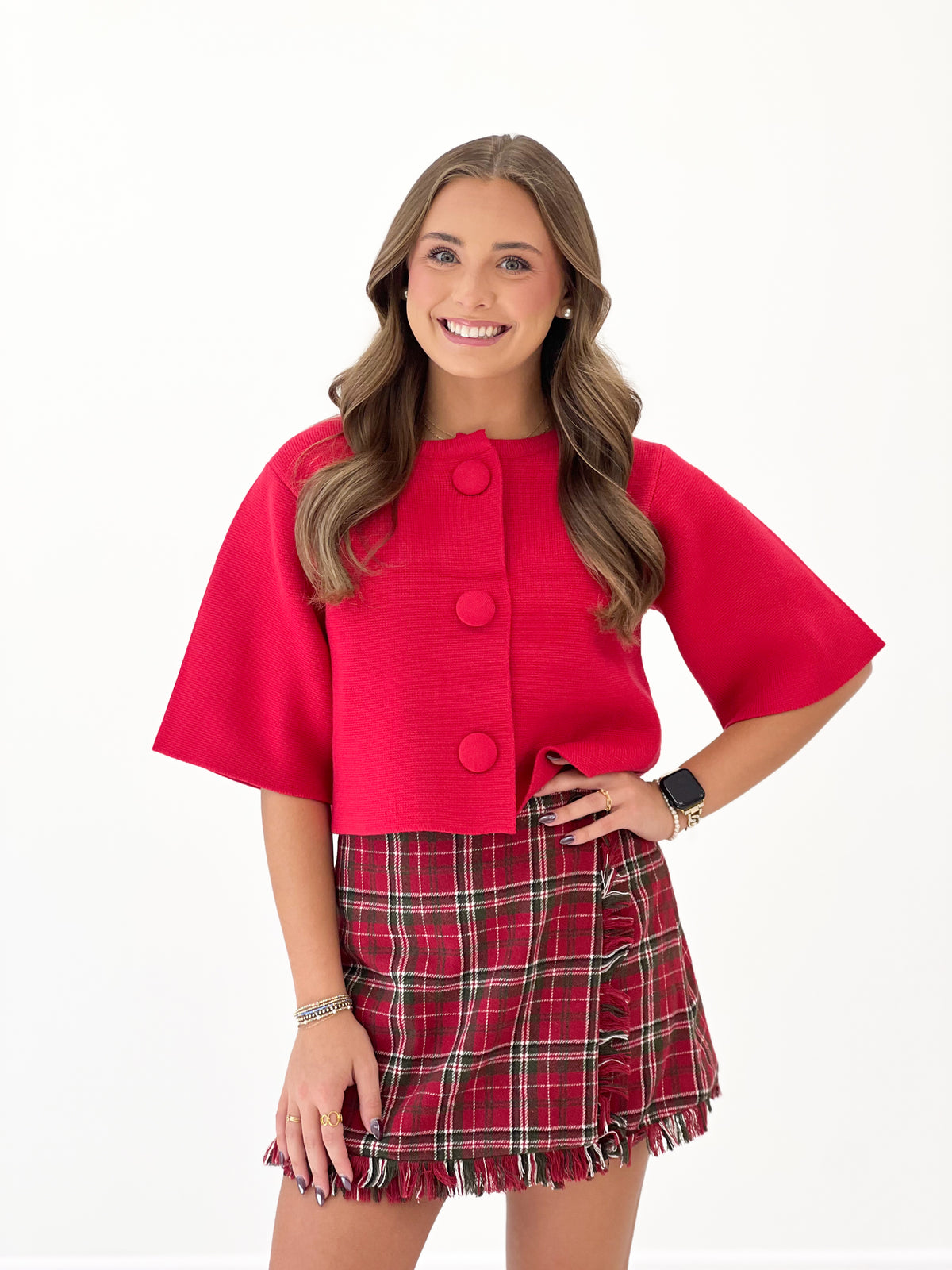 Red short-sleeve button-front sweater jacket with two-button placket and straight hem